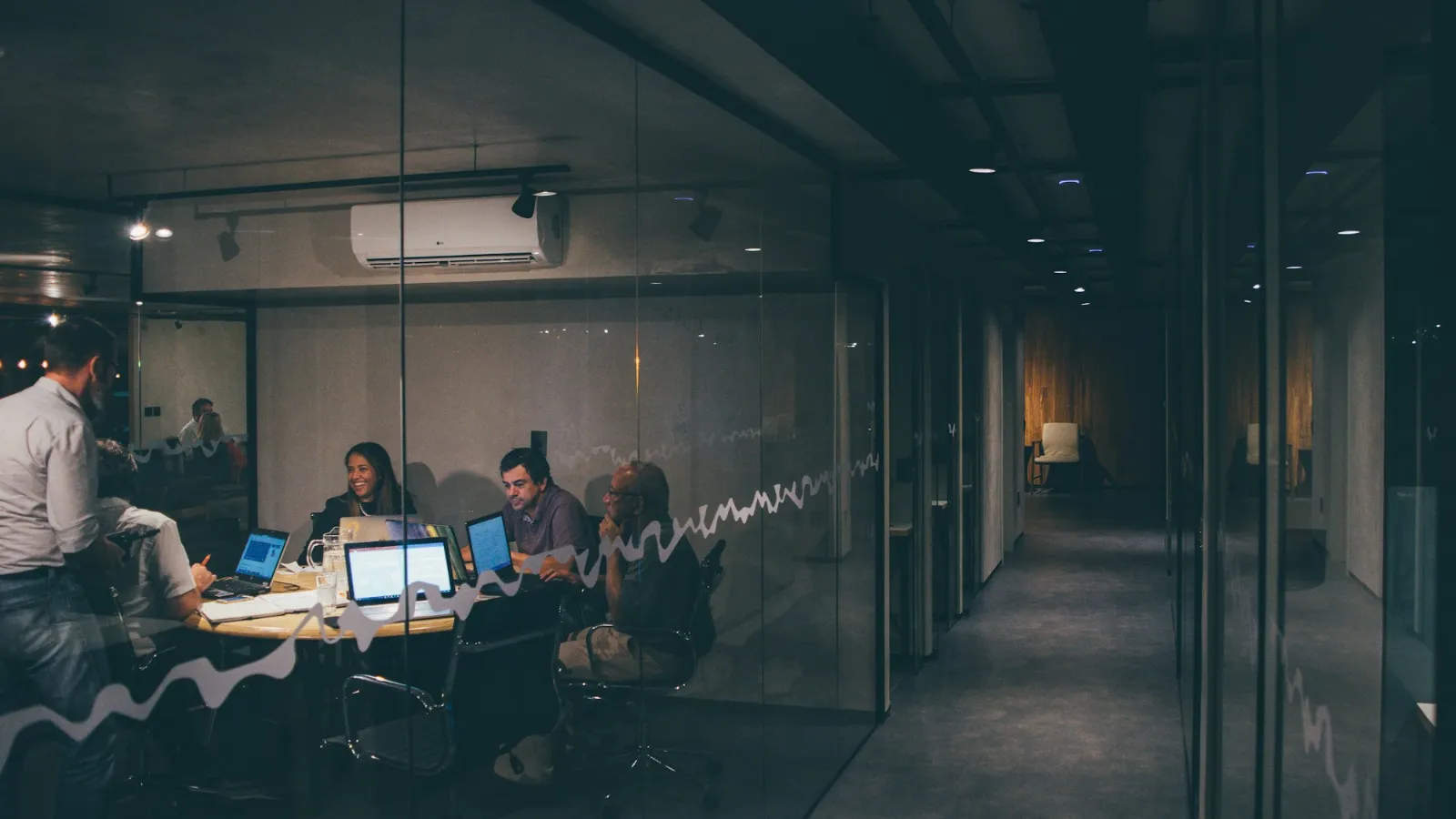 Business team meeting to decide whether to build or buy software