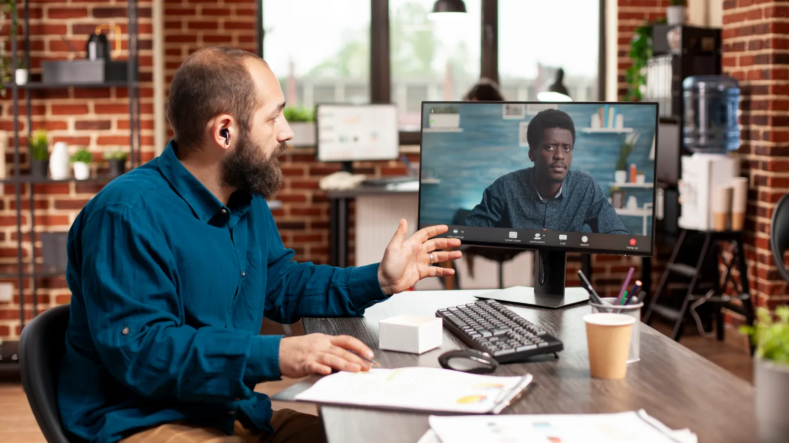 Manager on a video call with a remote web development team